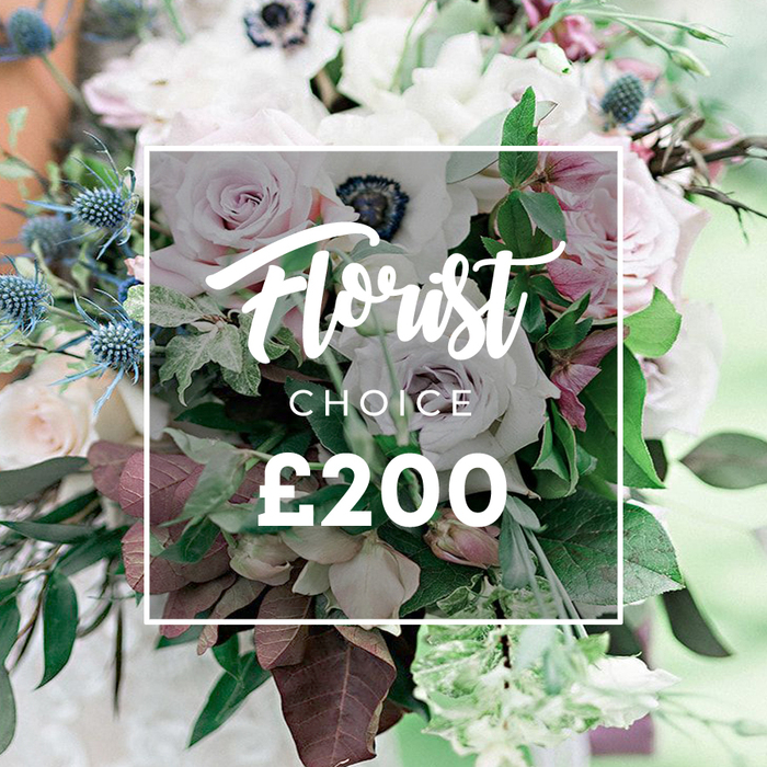 An elegant Florist Choice bouquet, photographed to showcase a couture sensibility in Canonbury. The center is punctuated by a semi-transparent white rectangle bearing Florist CHOICE and ?200, allowing the viewer to read the offer without distracting from the floral story. The color story unfolds in soft pastel tones-light pink garden roses fully opened to reveal tenderness, creamy white and pale lavender-grey roses, and white anemones with almost-black centers providing dramatic focal points. The arrangement is finished with blue eryngium thistles for a hint of architectural sparkle. Greenery plays a crucial role: slender eucalyptus-like leaves weave through the blooms, while burgundy leaves deepen the mood. The composition feels substantial yet airy, as if freshly gathered from Canonbury's well-kept streets and nearby parks. Light spills across the petals, highlighting velvet textures and the subtle sheen of the foliage, while the background suggests an outdoor setting-perhaps a sunlit courtyard near Upper Street or a parish garden. This is a bespoke arrangement, a testament to craft and seasonal sourcing, ideal for weddings, celebrations, or meaningful gifts. A local florist brings expert care to your doorstep, offering careful selection, thoughtful delivery, and a touch of neighbourhood charm that makes every bouquet feel personal to Canonbury residents.