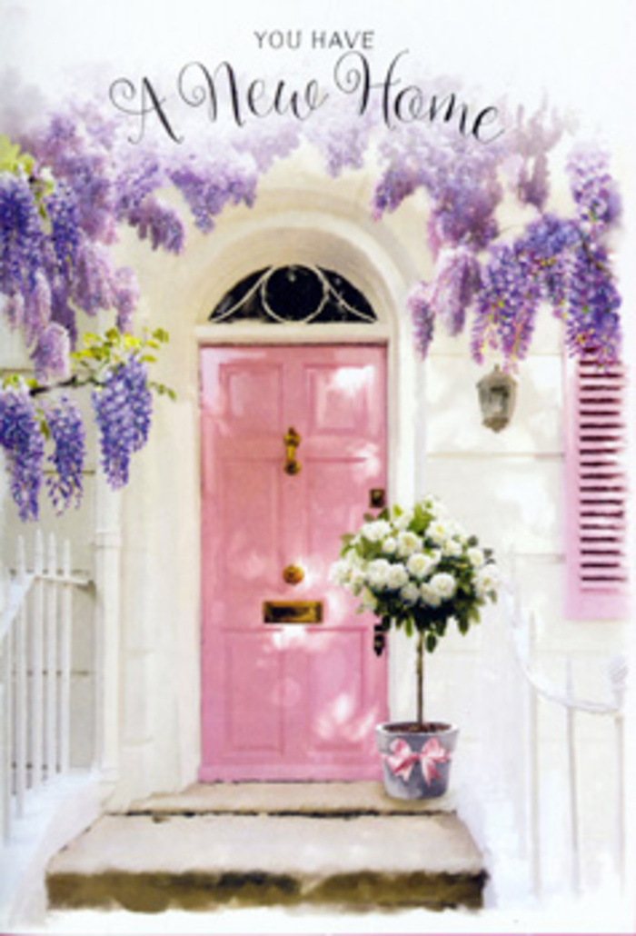 A welcoming pink front door, likely belonging to a quiet Canonbury townhouse tucked between leafy plane trees, becomes the centrepiece of a gentle, celebratory scene. The door is painted in a soft, milky blush, its colour echoed by a single shutter nearby, all set against softly weathered white walls that catch the afternoon light. Overhead, wisteria cascades in full spring bloom, its clusters of lavender and lilac blossoms hanging like fragrant curtains, twisting around pale branches and casting delicate shadows onto the façade. Beneath this floral canopy, a stylish tin bucket in a cool grey tone sits on the doorstep, brimming with white and cream roses arranged with a florist's practiced hand. Each rose appears freshly opened, petals rounded and velvety, layered among sprigs of fresh green foliage that add texture and a hint of woodland softness. Around the bucket, a satin pink ribbon is tied in a neat, flattering bow, its sheen catching the light and mirroring the pastel mood of the doorway. The entire scene feels calm and poised, as if captured just after a same-day housewarming delivery to a new home near Essex Road or New River Walk. You can almost imagine the subtle mingling of scents: the sweet, powdery aroma of wisteria overhead and the classic, comforting fragrance of roses below. This is not a loud or showy moment, but a quiet floral embrace, a thoughtful way of saying, welcome home to someone settling into their new Canonbury address, with flowers that suggest long, happy evenings and future celebrations to come.