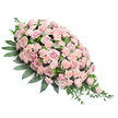 A lush, elongated sympathy spray is pictured against a crisp white backdrop, its composition forming a classic, gently sloping teardrop that appears ready to rest atop a casket or memorial table. The heart of the design is a dense field of pink roses, their plump, layered petals unfolding in soft blush and rose shades that feel tender and soothing rather than bright or showy. Among them, countless light peach-pink carnations are tucked in, their finely frilled petals adding movement and volume so the entire top surface seems padded with blossoms. The flowers are arranged so closely that they form a continuous, cushioned blanket of colour, symbolising comfort and closeness. Encircling and weaving through this mass of blooms is deep green foliage: broad, substantial leaves frame the arrangement, while more delicate sprigs and tapered leaves extend outward, especially toward the narrow, pointed end on the right. This trailing greenery lends an organic, slightly cascading look, as if the spray were gently flowing in one direction. The simplicity of the white background ensures that every nuance of pink and green stands out clearly, much as flowers do in a well-lit window of a Canonbury side street florist. The overall feeling is one of quiet grace and composed sorrow, designed for those seeking a refined, traditional tribute for a funeral or cremation service. Each rose and carnation seems chosen to say what words sometimes cannot: a message of sympathy, gratitude for a life lived, and a gentle farewell held in petals and leaves.