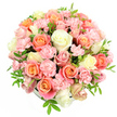 A full, rounded bouquet of pastel blooms is photographed against a crisp white background, its many roses and carnations forming a soft, domed silhouette. At the centre and spilling outward, generous roses in peach, coral, and gentle salmon pink open fully, their petals curving in smooth, concentric spirals. They are balanced by creamy white and almost buttery pale yellow roses, which introduce light and clarity, creating a calm, uplifting contrast. Threaded among these larger blooms, small clusters of pale pink spray carnations add a playful ruffle; each tiny blossom is made up of delicate, fringed petals that lend the whole design a luxurious, cushion-like texture. Fine, pointed green leaves and discreet filler foliage weave through the flowers, bringing subtle hints of freshness, reminiscent of a stroll through the quiet green corners around Canonbury and nearby New River Walk. The flowers are arranged very closely together, forming a compact, spherical mound in which the vessel is barely visible, suggesting a hidden hatbox or low round container supporting the design from beneath. Even, bright lighting reveals the richness of each petal and the gentle interplay between blush, ivory, and soft yellow, without any distracting shadows. The impression is one of serene joy and intimate celebration, perfect for welcoming spring into a Canonbury apartment, sending warm congratulations to a friend off Essex Road, or marking Mother's Day with a bouquet that feels both indulgent and quietly elegant, as if created for a cherished local client by a florist who knows their tastes well.