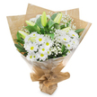 An elegantly hand-tied bouquet of white and green flowers is photographed upright against a bright white background, giving the arrangement a sense of clarity and stillness. The central focus rests on clusters of daisy-like white chrysanthemums, their neat rings of petals forming soft, rounded faces around lively yellow-green centres that add a gentle, hopeful glow. Interspersed with these daisies are stately lily buds, tall and slender, each one tightly closed with smooth, pale green outer petals that fade to creamy white at the tips, like quiet promises of fragrance yet to be released. Threaded delicately through the design are tiny blossoms of white baby's breath, forming airy sprays that float between the larger blooms, lending the bouquet volume without weight and a whisper-soft texture. Supporting this interplay of white flowers is a foundation of deep green foliage, the leaves glossy and substantial, shaping the bouquet into a full, balanced dome. The stems are gathered together in a neat bundle, wrapped first in softly crinkled brown kraft paper that introduces a natural, earthy touch reminiscent of a bouquet collected from a Canonbury side street after a walk through nearby Islington gardens. Over this lies a sheath of transparent cellophane, gently wrinkled, adding a protective layer and a subtle shine that reflects the light. The overall impression is of a calm, thoughtful arrangement that feels perfectly suited to sympathy occasions, memorial services, or gentle get-well wishes across Canonbury and the surrounding neighbourhoods, offering a quiet expression of care, remembrance, and peaceful support.